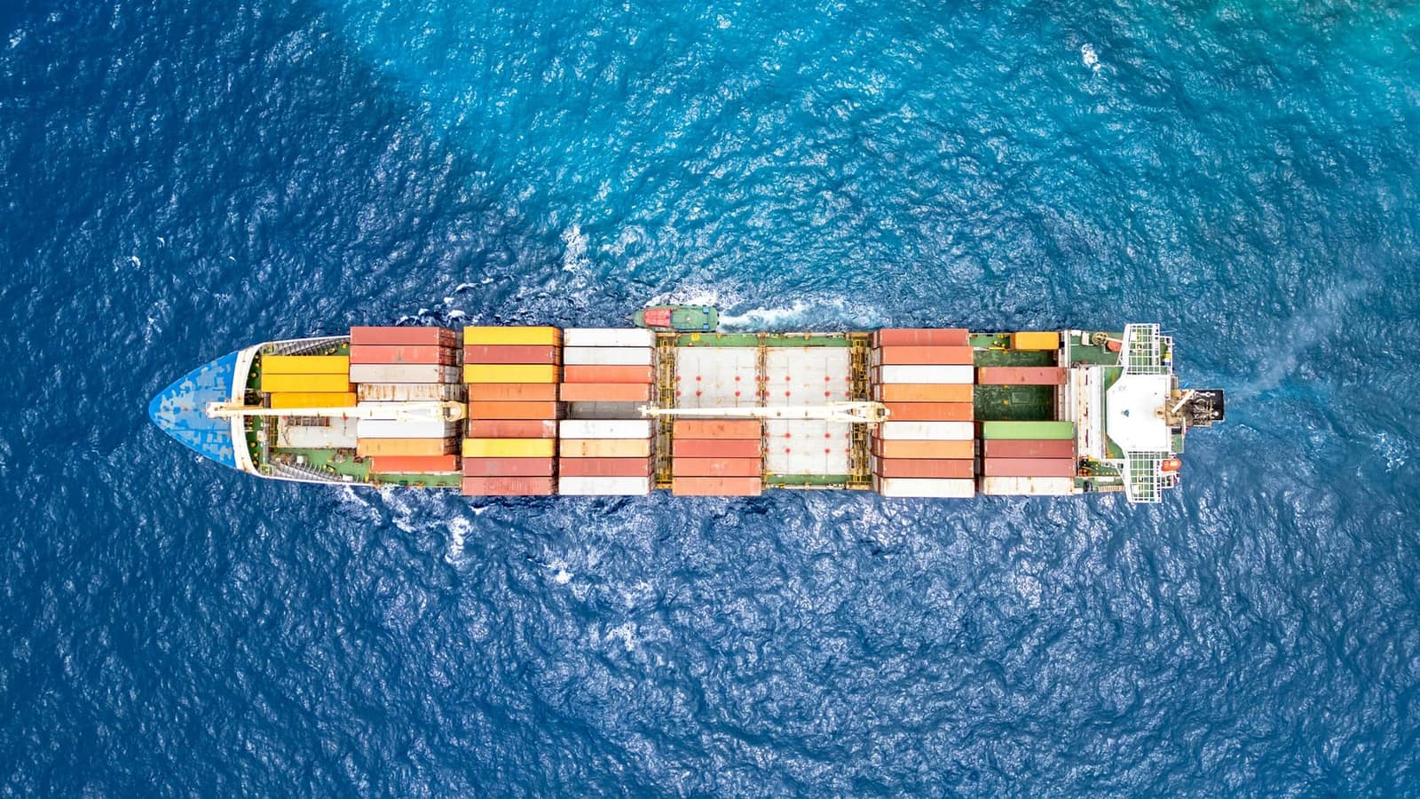 Container ship at sea, aerial view